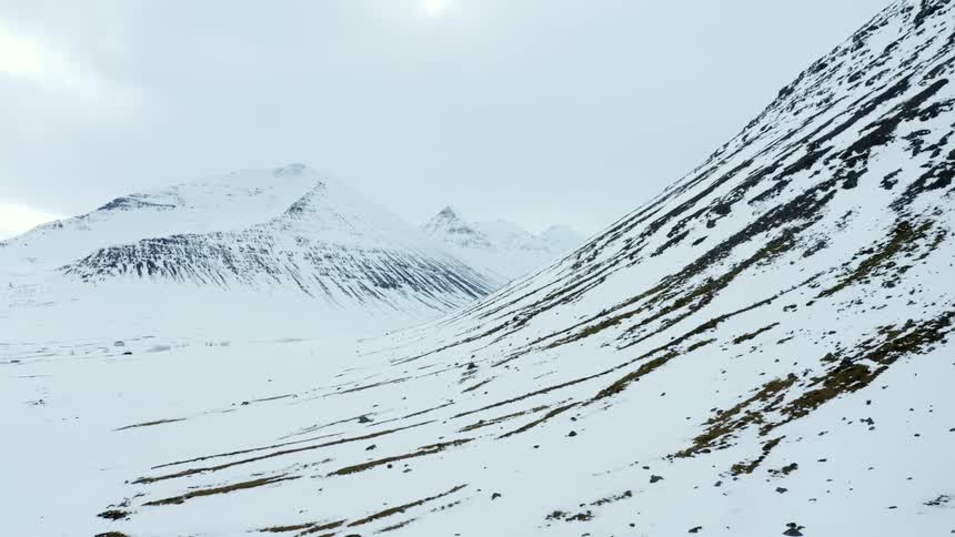 Landscape of mountains with natural wear and covered by snow