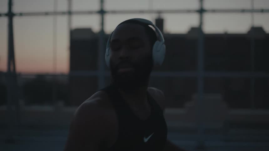 Portrait of a man walking with a white headset