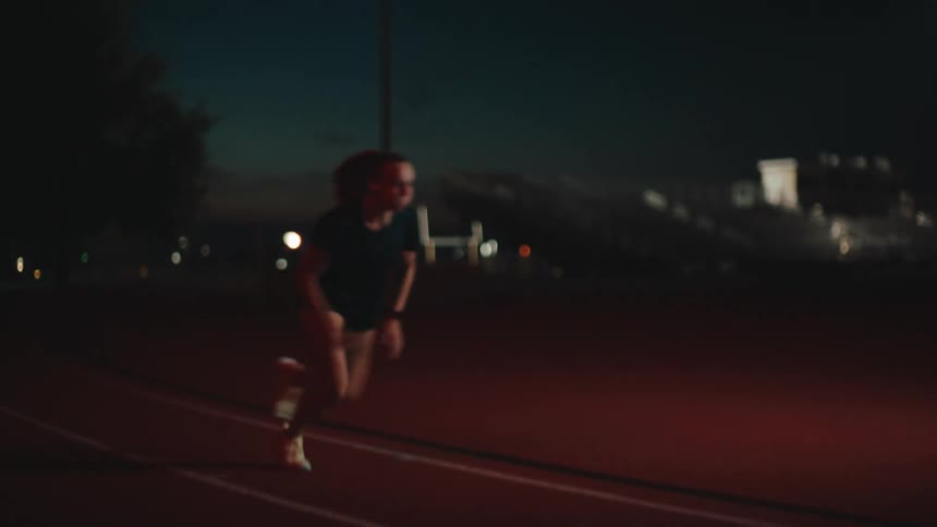 A woman races on the track