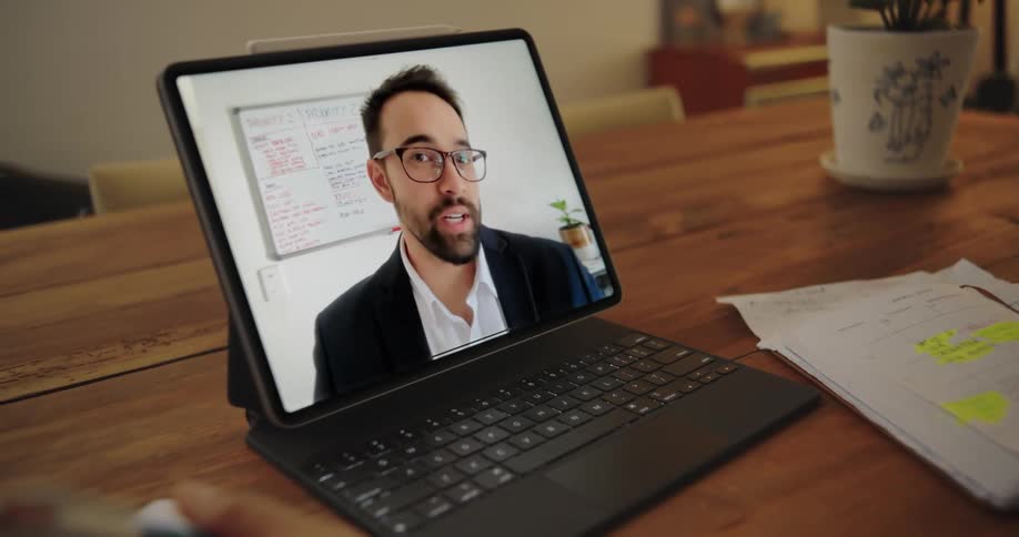 A man is talking on a videocall