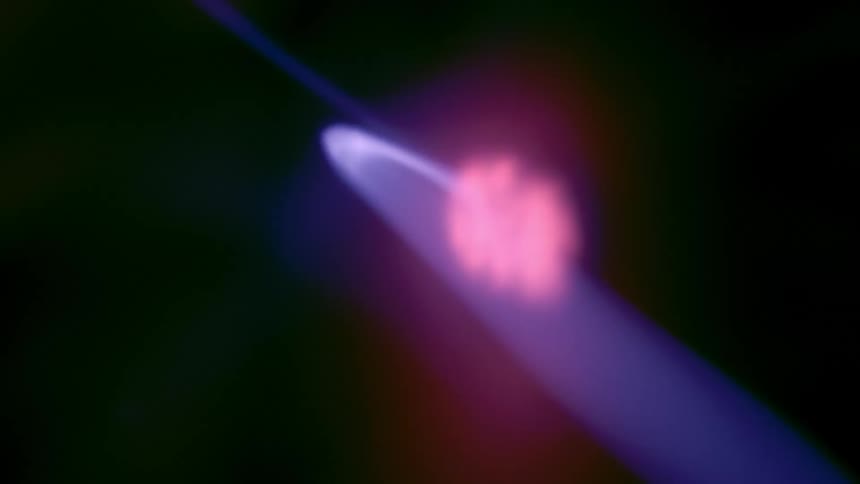 Purple and pink neon lights in abstract motion