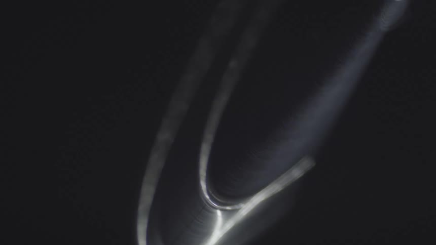 Abstract disc in motion against a black background