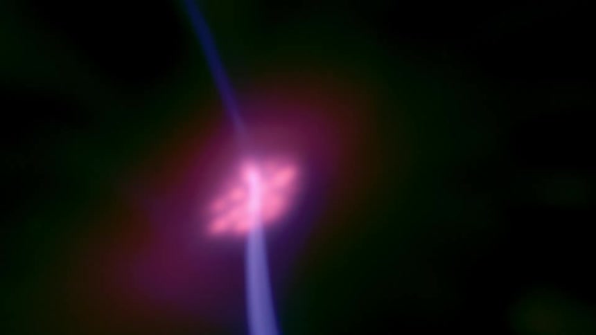 Filaments arc through interior of plasma sphere in a dark area