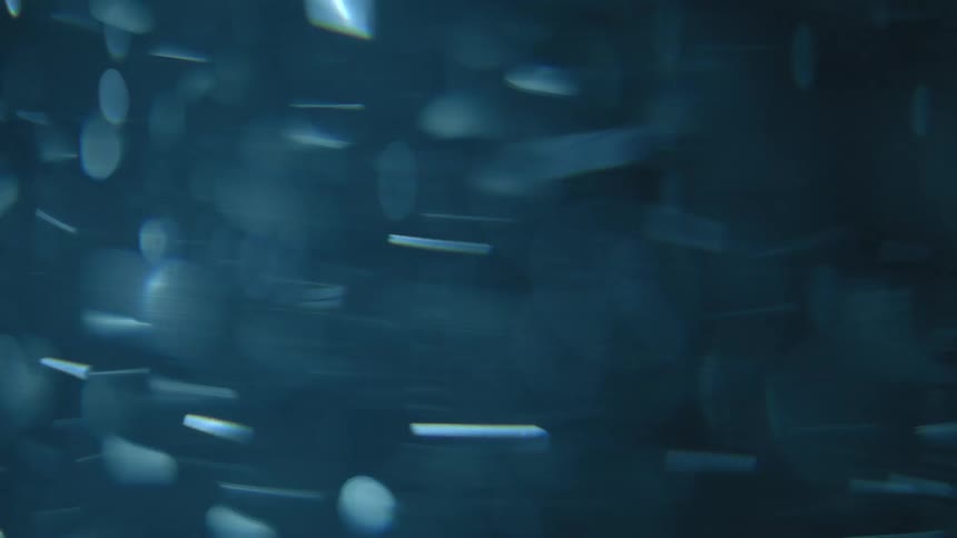 Flashing blue particles moving circularly