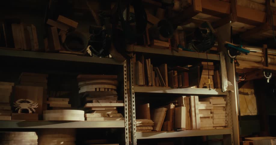 Shelves in a carpenters workshop full of tools and blocks of wood