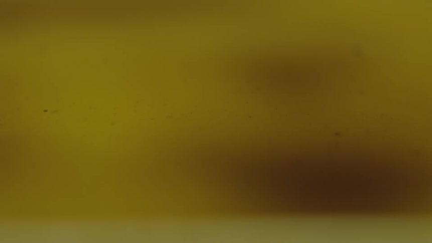 Dense abstract golden liquid in circular motion