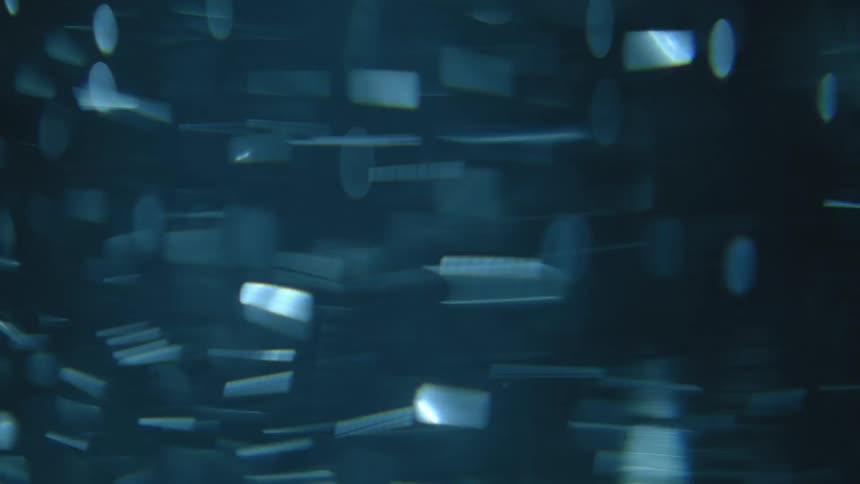 Extreme close up of water with swirling particles