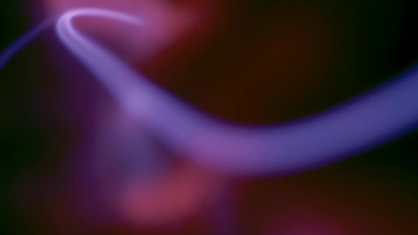 Blue bolts move through the interior of a plasma lamp