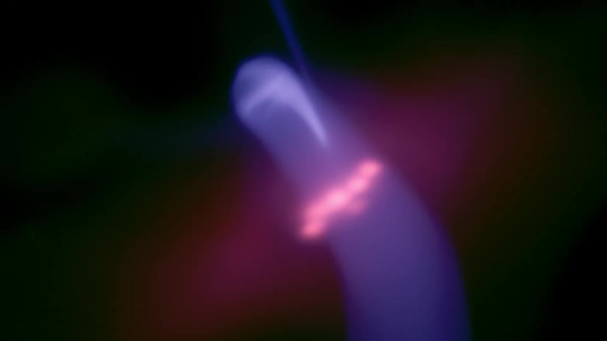Close up of a purple electric plasma beam against a dark backdrop