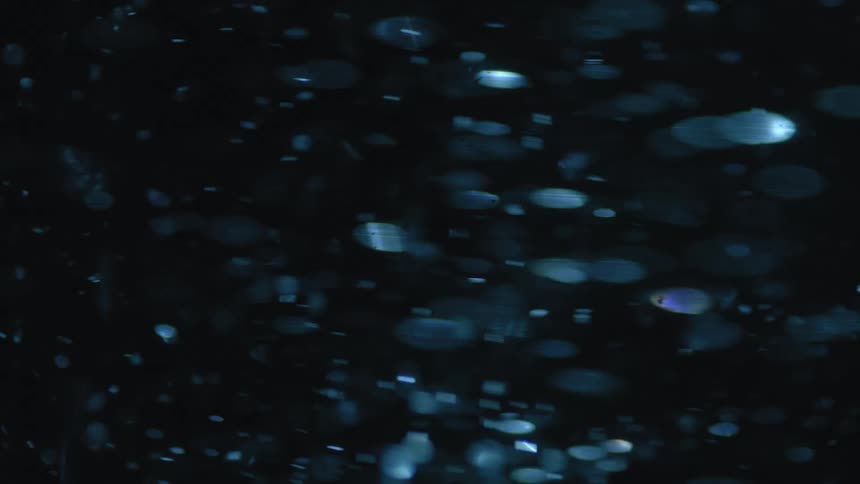 Fast moving particles in dark liquid