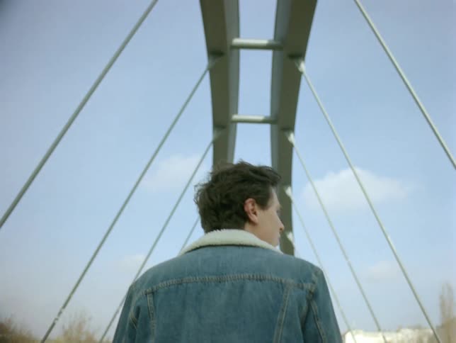A back clip of a male walking