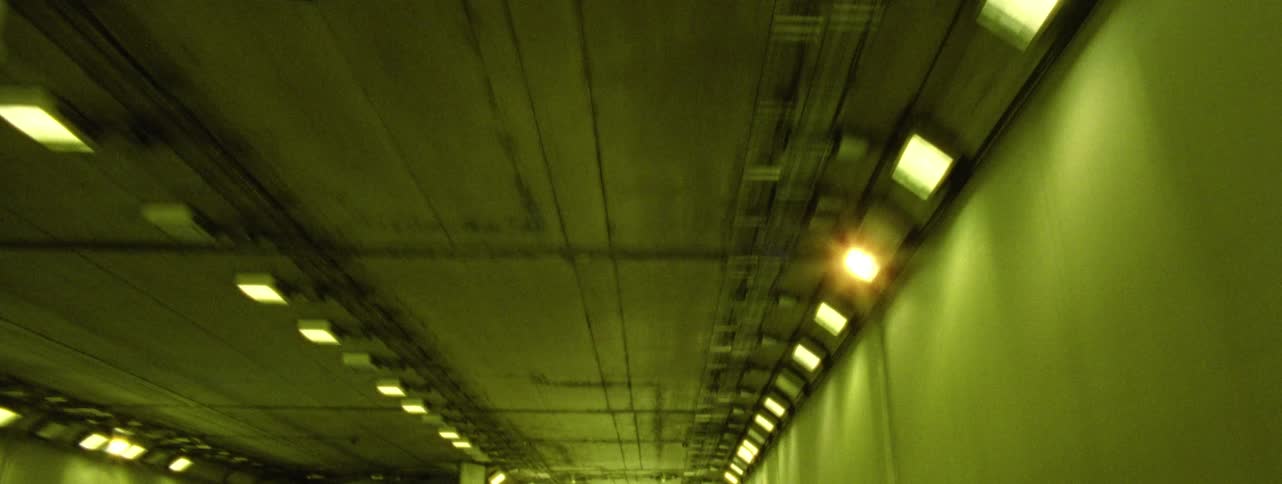 Passing through a long tunnel in a metropolis at night