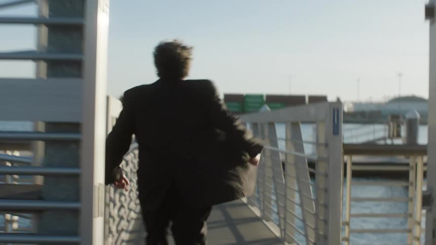 A man runs on the pier