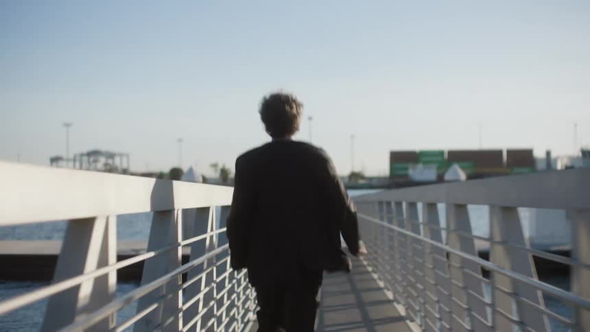 A man is running on the pier