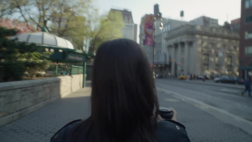 A woman strolls through downtown new york city