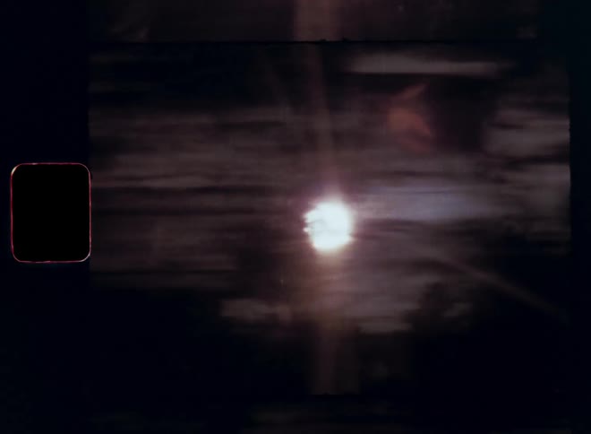 The bright sun shines in through the trees while looking out of the car window and moving with high speed and dynamic motion as the warm light causes lens flares and glares while it bounces quickly on vintage Super 8 film footage