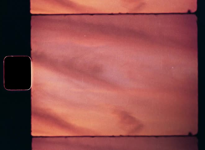 The clouds in the sky glow red and pink during the last evening light of the setting sun after sunset or the first morning light from the early sunrise with vibrant colors