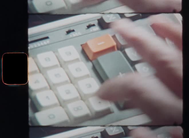 Old super 8mm film footage of a white persons hand typing on a calculator machine as part of the business bookkeeping and then printing a tax receipt or sales slip for a customer or the tax return