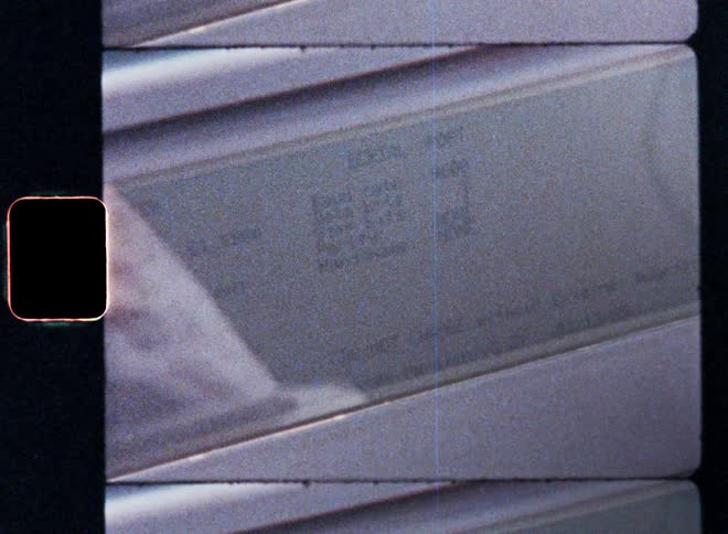 Retro computer screen display or monitor from the 1980s displays or shows various numbers or digits and a digital map of the world symbolizing the progress of computer tech and communication technology on vintage 8mm film with nostalgic vibe