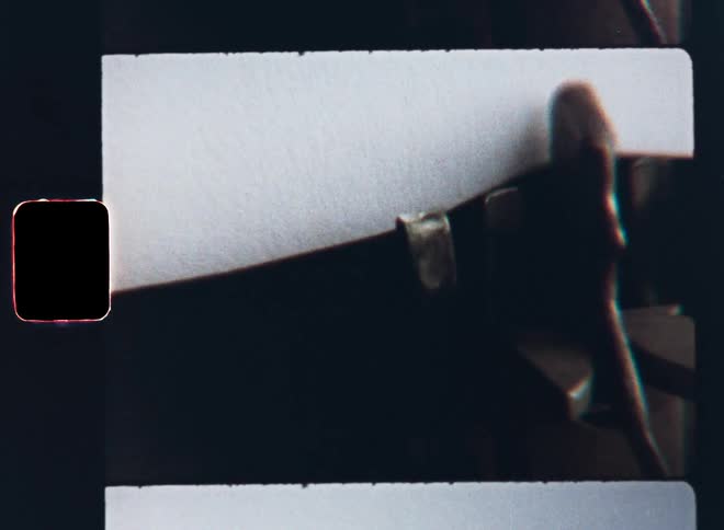 In a S8 closeup shot a vintage typewriter gracefully types out the words thank you since the author wants to express his gratitude and gratefulness while typing a letter on a white piece of paper using his old text machine