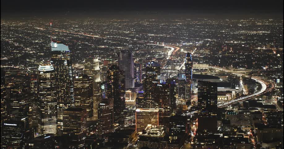 Downtown Los Angeles, the 110 Freeway, and Staples Center are illuminated in a vast aerial shot