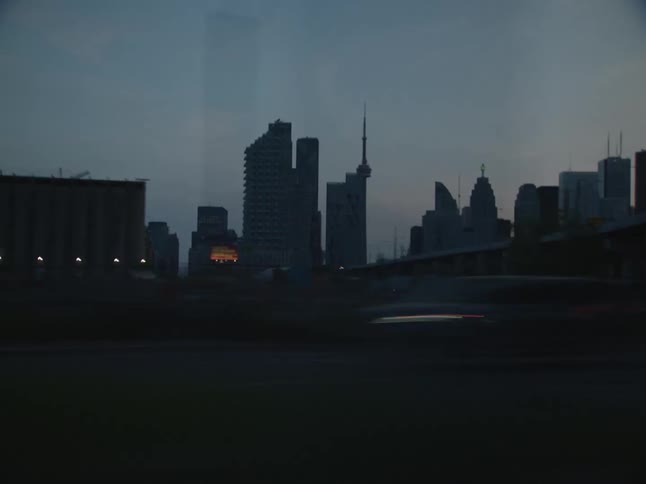 A car races down a road in a city