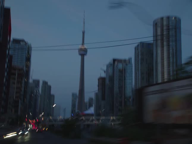A tall tower is near the skyline