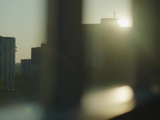 The sun is rising on the apartment buildings