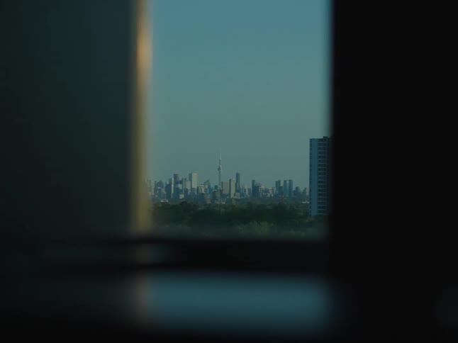 A large downtown city area seen through a window