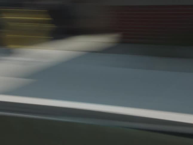 A vehicle speeds through the downtown area of the city