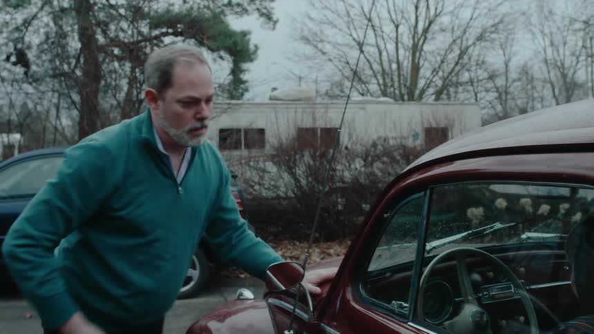 A man runs out and opens the car door