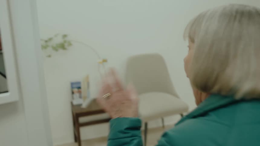Portrait of a lady sitting in an armchair getting up in anger and going after a man arguing