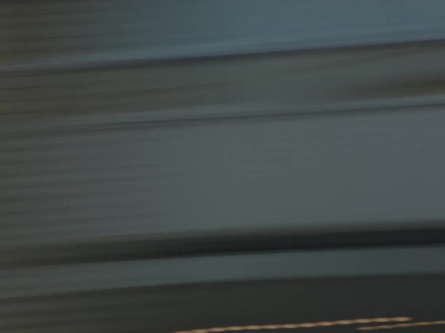 Close up of the facades of buildings in the city seen from a moving vehicle
