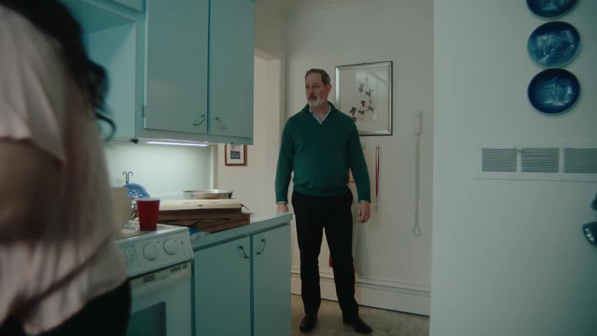 A man runs out of the kitchen
