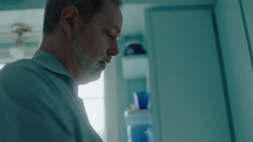 Man storing a product in the closet and then dismantling a box
