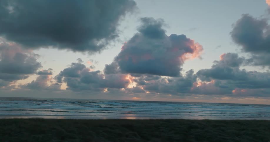 Natural landscape of a beach with clouds in the morning sky