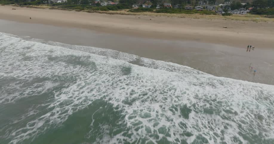 Aerial view of a placid coastline near a small town