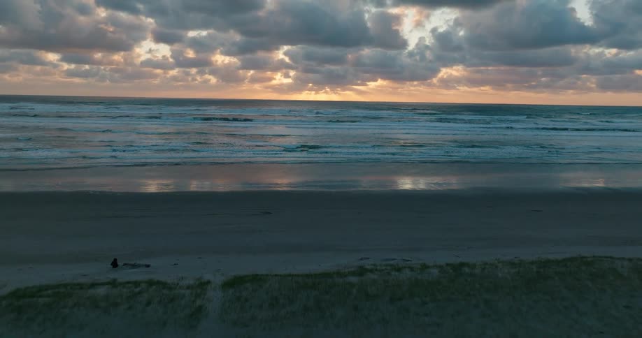 Aerial view of a serene beach scene during the evening