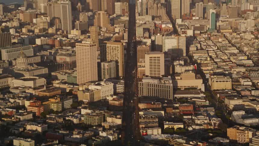 Aerial panorama of intersections in a metropolis with large urban and commercial buildings on the waterfront