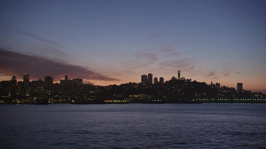 The san francisco cityscape and waterfront in the evening