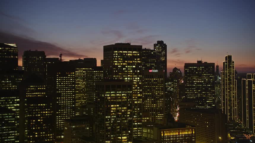 A major road running through a city at dusk