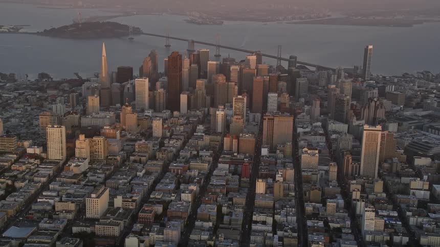 View from above of a metropolis with large buildings urban areas and the seaside in one morning