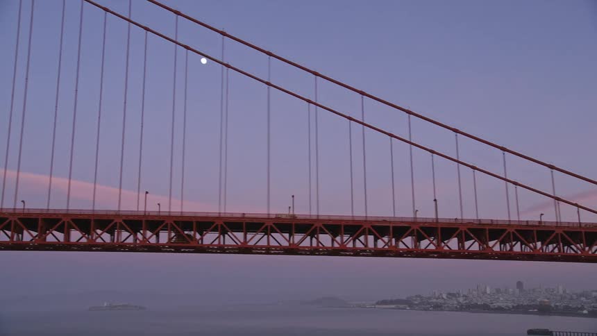 Aerial view of the full moon over the golden gate bridge in san francisco at evening