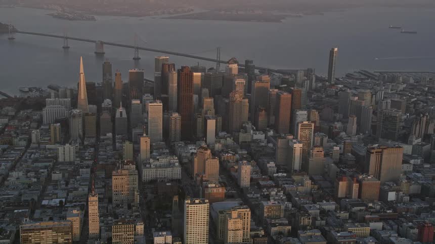 An aerial view of san francisco showing the golden gate bridge and the citys dense skyline