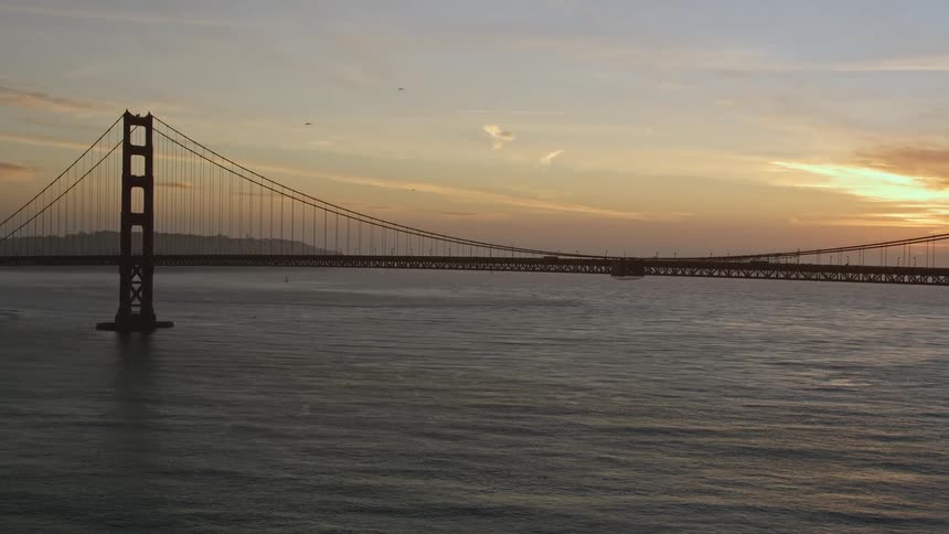 Aerial landscape of the sunrise behind the golden gate bridge