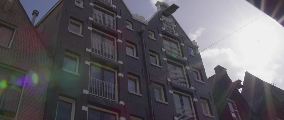 Facade of residential buildings under a bright sky