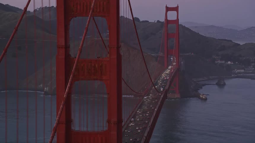 Aerial panorama of the golden gate bridge with vehicle traffic at dusk