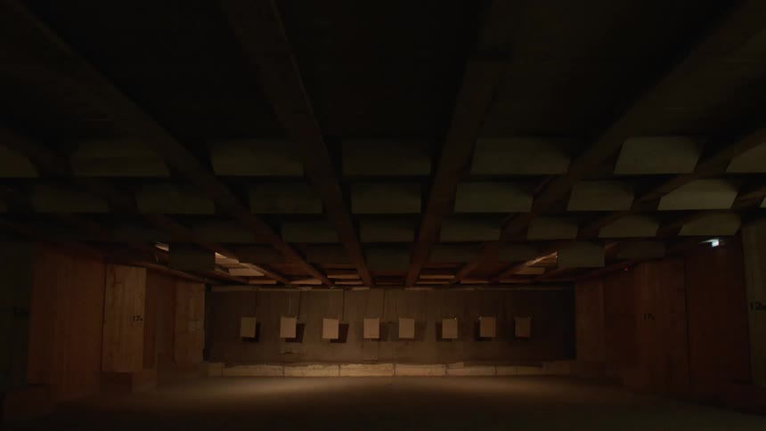 The lights on a shooting range turn on