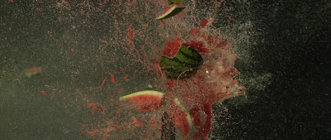 Watermelon explodes after being hit by a bullet, shot in super slow motion at 30,000 frames per second.