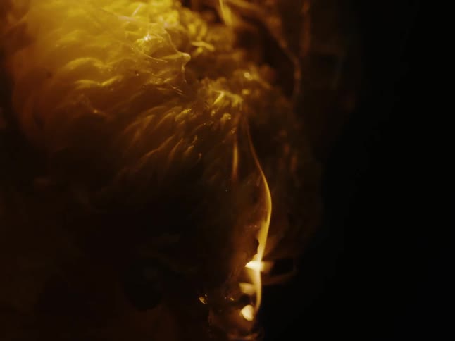 An object is melting and is filled with fire and ignites on its surface
